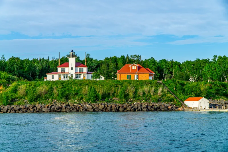 The Raspberry Island lighthouse as seen from Lake Superior on an Apostle Islands cruise. Another building is next to it on the right.