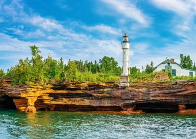 The lighthouse and cliffs of Devil's Islands, as seen from a Grand Tour.